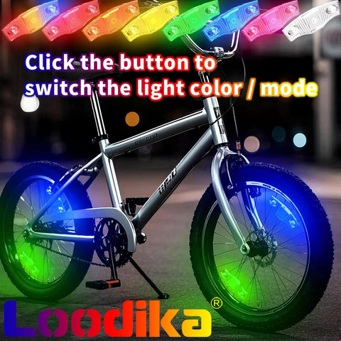 Rechargeable Bike Wheel Lights Set of 2 with Motion Sensor illuminating bike wheels in 7 color LED glow outdoors at night.
