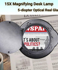15X Magnifying Glass Desk Lamp With Clamp Real Glass Lens over newspaper, showcasing text magnification detail
