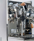 Close-up of Pro Grade Dual Boiler Espresso Maker With PID Precision Tuning, stainless steel frame, steam wand, brew head.