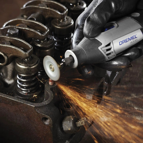 Close-up of EZ Lock Aluminum Oxide Rotary Tool Grinding Wheel Set in use, grinding metal edges with sparks flying