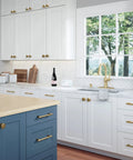 Modern kitchen with Six Pack Antique Brass Drawer Pulls For Kitchen Cabinets And Dressers on white and blue cabinets.