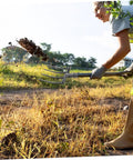Person using Heavy Duty Steel Four Prong Pitch Fork For Digging And Loosening Soil Manure Rake With Easy Attach To Handle