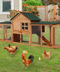 Spacious Wooden Chicken Coop And Rabbit Hutch With Dual Level Runs Waterproof Asphalt Roof Removable Tray Nest Box Outdoor Hen House For 2 To 4 Chickens Or Small Animals Backyard Pet Cage in a garden with chickens nearby.