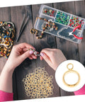 Top Shelf Go To Diy Jewelry Making Kit Featuring Stainless Steel Bail Bead Jump Rings And Polished Chrome Spacer Links For Custom Necklaces Bracelets And Artisan Creations with gold bail beads in hands.