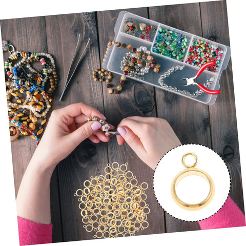 Top Shelf Go To Diy Jewelry Making Kit Featuring Stainless Steel Bail Bead Jump Rings And Polished Chrome Spacer Links For Custom Necklaces Bracelets And Artisan Creations with gold bail beads in hands.