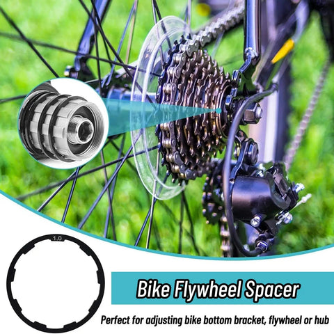 Close-up of a bike flywheel with Three Size Cassette Spacer Set For Bikes 1Mm 1.5Mm 2Mm Headset And Flywheel Hub Spacers.