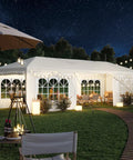 10x30 Ft Outdoor Party Tent With 8 Removable Sidewalls, Large Canopy Gazebo for Weddings, shown in a backyard at night with lights.
