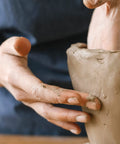 Hands shaping a sculpture with Premium White Air Dry Clay 3.3 Lb Self-Hardening Ultra Fine With Exceptional Plasticity For Studio Use
