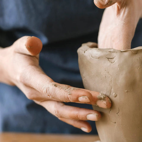 Hands shaping a sculpture with Premium White Air Dry Clay 3.3 Lb Self-Hardening Ultra Fine With Exceptional Plasticity For Studio Use