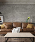 Living room with a brown sofa against 24 By 354 Inch 3D Wide Concrete Wallpaper Peel And Stick Self Adhesive Vinyl Wrap in light grey
