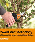 Person using PowerGear2 Pruning Shears With Rolling Handle For Effortless Pruning Three Quarters Inch Cut Capacity Bypass Pruner