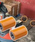 Premium GYUPTRK Load Wheel Kit For Toyota 8HBW23 Electric Pallet Jack Truck displayed with polyurethane wheels beside pallet jack.