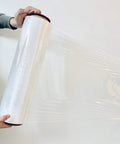 Kickass Ergonomic Plastic Hand Savers For Stretch Film Dispensing Slick Universal Handles Fit 2.95 To 3.05 Inch Cores held while unrolling stretch film.