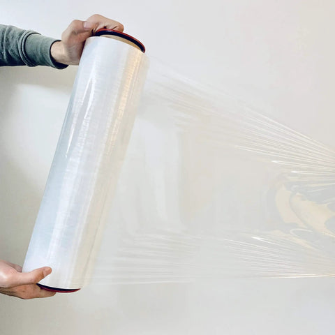 Kickass Ergonomic Plastic Hand Savers For Stretch Film Dispensing Slick Universal Handles Fit 2.95 To 3.05 Inch Cores held while unrolling stretch film.