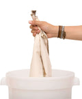 Person holding Industrial 10 Gallon Reusable Coffee Filter Set With Organic Cotton GOTS Certified Two Pack for Large Urns over bucket