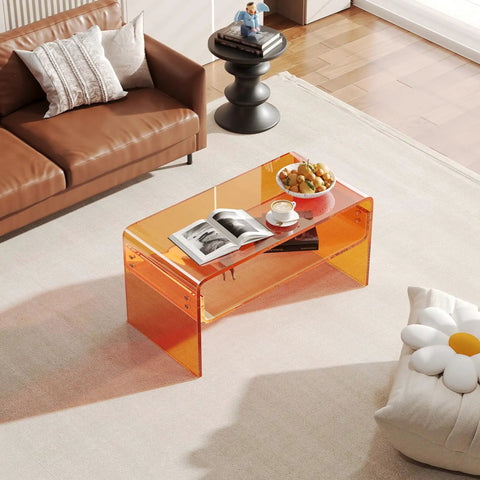 Orange Acrylic Coffee Table With Open Storage Two Tier Clear Modern Coffee Table For Living Room Office Reception And Bedroom Transparent Side Table With A Dope See Through Look And Durable Build in a living room setting with decor items.