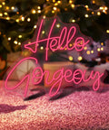 Hello Gorgeous Pink LED Neon Sign For Bedroom And Parties on wall, vibrant pink, flexible silicon and acrylic, romantic decor.