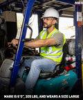 Man operating a forklift wearing a Neon Yellow High Visibility Safety Vest ANSI Class 2 with two pockets, size large.