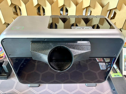 4-Inch Odor Eliminator Adapter Fume Extractor for E1 UV Printer with black high-temp PETG material attached to printer