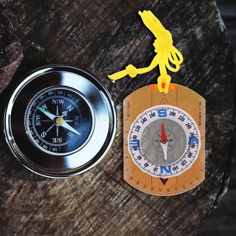Beast Survival Compass With Lanyard For Outdoor Adventures, sleek vintage compass on wooden surface, portable navigation tool