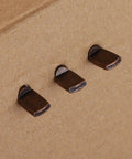 Heavy Duty Stainless Steel Shelf Support Pegs That Never Quit On You 120 Piece Kit For Bookcases Cabinets And Kitchen Shelving Systems Rust Proof And Super Easy Setup Deep Brown close-up of deep brown stainless steel shelf support pegs.