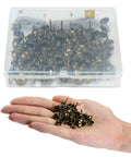 Hand holding Bronze Upholstery Tacks 100 Pack Decorative Nail Heads for Furniture, Antique Brass Finish with measuring tape in box