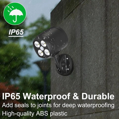 Two Pack Outdoor Motion Sensor Lights With 6000K LED Spotlight Battery Powered 8W 600 Lumen Security Lights for Garage and Yard No Fuss Install Long Range Motion Sensing Up To Five Meters mounted on a wet wall showcasing IP65 waterproofness.