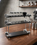 Single Dose Coffee Bean Container Coffee Station Organizer Rack With 8 Sealed Glass Vials One Way Valves And Dosing Funnels Kitchen setup with glass vials.