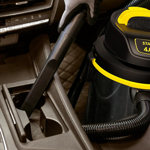 Heavy Duty Wet And Dry Vacuum Cleaner With 4 Gallon Tank And 4 HP Power, cleaning a car interior with stainless steel canister