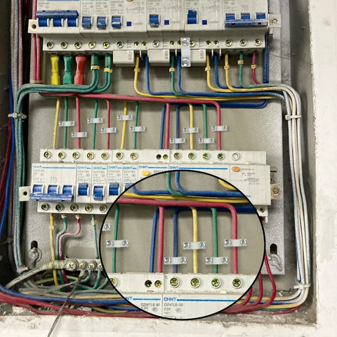 Electrical panel with colored wires, close-up shows screws and clips, fitting 24 Piece Wire Shelf Clip Kit With Screws And Expansion Tubes