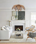 Handcrafted Rattan Chandelier With Three Bright Bulbs For Your Dining Room Or Kitchen Island in a cozy living room setting.
