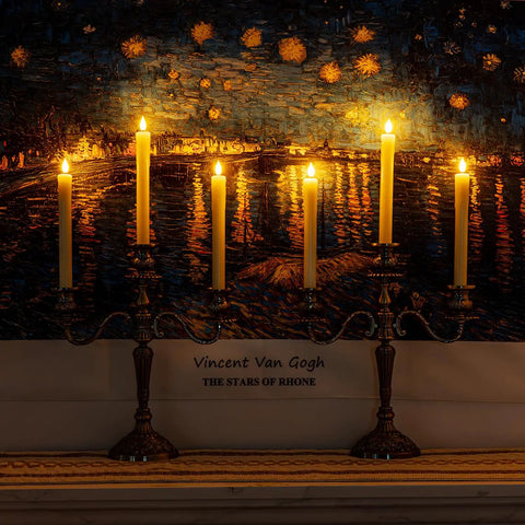 Real Wax LED Flameless Taper Candles With Remote Timer 9.6 Inch Ivory Dripless Battery Operated Window Candles glowing on mantelpiece