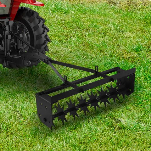 Tow Behind Lawn Aerator 32 Inch Heavy Duty Core Aerator Tool with universal hitch attached to tractor on grass