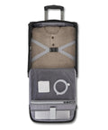 Ascella 4 Underseater Carry On Luggage that Fits Under Airplane Seats with organized interior, showing grey strapped clothing and essentials.