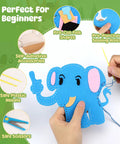 Hands sewing blue felt elephant from Kids Beginner Sewing Kit With Felt Crafts For Ages Six And Up, DIY Jungle Stuffed Animals Making Set.