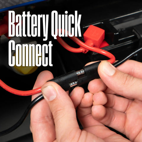 Hands connecting battery cable on Dual Fuel Portable Generator With Remote Start Transfer Switch Ready Gas Or Propane Powered Backup.