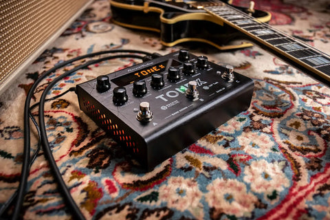 TONEX Pedal Ultra Realistic Stereo Multi-Effects For Guitar And Bass With 150 Gig-Ready AI-Powered Presets on a patterned rug