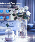 Firefly String Lights With Remote, 66 Feet Of 200 LEDs, Indoor Outdoor Plug In, IP65 Waterproof, USB Or Adaptor Powered, Pure White Warm Glow For Bedroom Or Party Decor, Tree Wreath Ceiling, Perfect For Chill Vibes At Weddings And Holidays illuminating two flower vases indoors