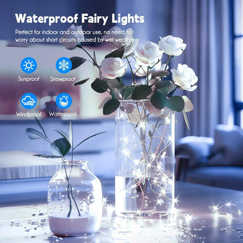 Firefly String Lights With Remote, 66 Feet Of 200 LEDs, Indoor Outdoor Plug In, IP65 Waterproof, USB Or Adaptor Powered, Pure White Warm Glow For Bedroom Or Party Decor, Tree Wreath Ceiling, Perfect For Chill Vibes At Weddings And Holidays illuminating two flower vases indoors