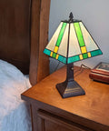 Tiffany Style Table Lamp With Stained Glass Mission Glass Panels In Rich Colors For Classic Living Room Or Bedroom Decor 8 Inch Shade 14 Inch Total Height Sturdy Metal Base Warm Ambient Glow Model AM354TL08 on a wooden nightstand