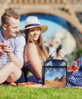 Insulated Reusable Lunch Box With Side Pocket And Detachable Handle For Work, Picnic, Camping next to couple in park
