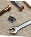 Heavy Duty 6 Piece T Slot Clamping Nuts Set Rock Solid High Strength T Nuts For T Slot Rails on a work surface with tools.