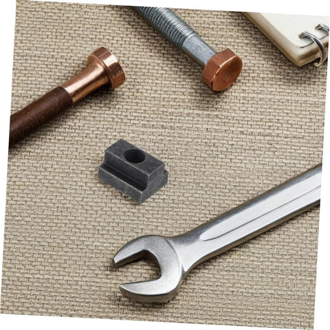 Heavy Duty 6 Piece T Slot Clamping Nuts Set Rock Solid High Strength T Nuts For T Slot Rails on a work surface with tools.
