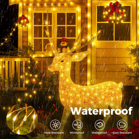 Dope Warm White Outdoor Fairy Lights With Remote, 33 Feet Of 100 LED Twinkle String Lights illuminating house and reindeer.