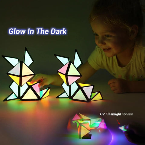 Child playing with Glow In The Dark Magnet Pyramid Cube 12 Piece With 243 Rare Earth Magnets Transforms Into Dope Billions Of Shapes