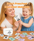 Mother and child engaging with educational flashcards next to a white label maker for preschool learning activities.