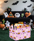 Lowkey Spooky Purple Ghost Storage Basket With Heavy Duty Cotton Linen Handles Dope Collapsible Organizer For Halloween Candy Toys Bedroom Closet Shelf Vibe Refresh filled with candy, placed in a festive room.