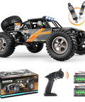 1-12 Scale All Terrain RC Truck With 4x4 Drive High Speed 38 Km/h Remote Control Car 2.4G Radio Long Range Off Road Toy For Boys And Adults Includes Two Rechargeable Batteries For 40+ Minutes Of Playtime, shown with accessories.
