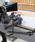 Heavy Duty Universal Woodturning Dust Hood Featuring Fully Adjustable Bracket And 100 Millimeter Hose Connector for lathe setup with wooden blank.