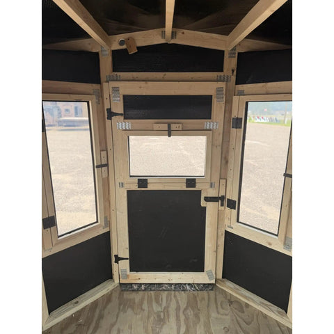 Interior view of Kick Ass Solid 6X8 Wooden Deer Blind Featuring Hella Warm R6 Insulation Panels with window openings.
